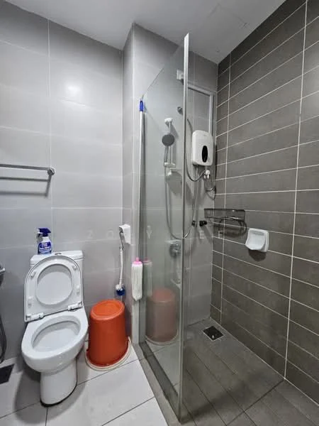 Bathroom features: white toilet, glass shower enclosure, rain shower head, handheld shower, grey tiled walls, white tiled flooring, wall-mounted shower heater, toilet paper holder, soap dispenser, shelf for toiletries; style: modern.