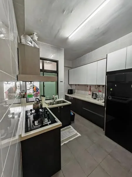 Kitchen features: black cabinetry, white upper cabinets, stainless-steel sink, chrome pull-down faucet, built-in gas hob, black refrigerator, white countertop, grey tile flooring, wall-mounted shelves, window with view to outside, kitchen towel on floor, decorative statue on shelf; style: modern.
