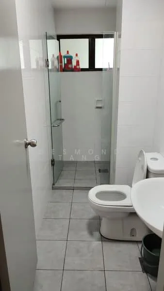 Bathroom features: white tiled walls, grey ceramic tile flooring, glass shower enclosure, chrome showerhead, toilet, single-sink vanity, mirror above vanity, window for natural light, shelves with toiletries; style: modern.