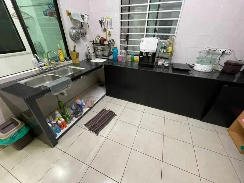 Kitchen features: double-bowl stainless-steel sink, chrome pull-down faucet, black laminate countertop, white tiled backsplash, white tiled walls, cream floor tiles, built-in cabinets, kitchen appliances including coffee machine, various cleaning supplies, dish rack, window with metal grille, floor mat; style: modern.