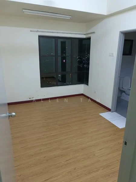 Room features: wooden flooring, white painted walls, floor-to-ceiling windows, city view, single light fixture on ceiling, door leading to bathroom, window treatments not visible, no visible furniture; view: city.