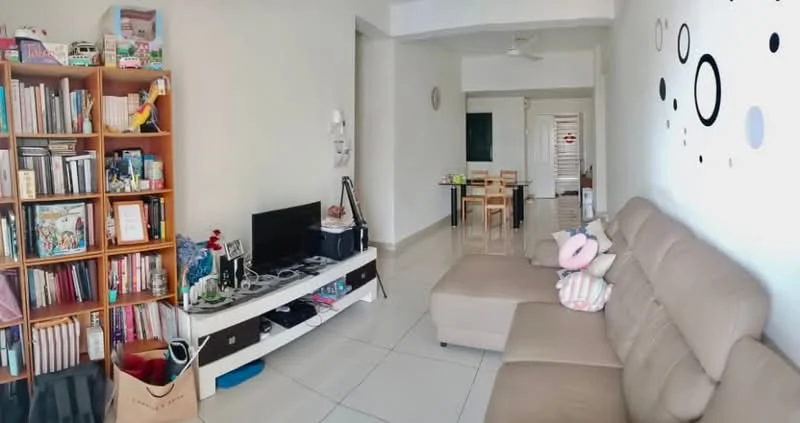 Living features: light grey leather sectional sofa, white coffee table, black TV console, flat-screen TV, bookshelf with wooden finish, decorative wall with circular patterns, white walls, tile flooring, ceiling fan, dining area visible in background, area rug; style: modern.