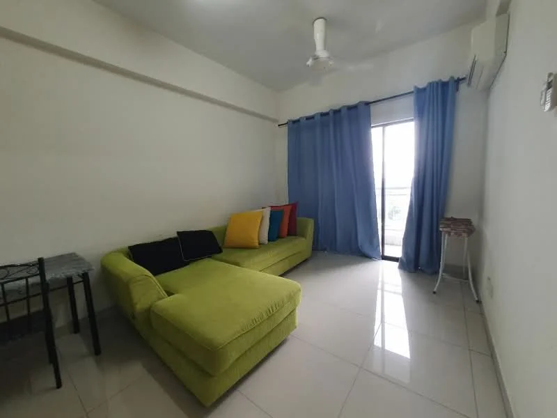 Living features: green L-shape sectional sofa, black throw pillows, yellow throw pillows, blue curtains, floor-to-ceiling sliding glass door, white painted walls, ceiling fan, glossy tile flooring, small side table, metal frame table; style: modern; view: city.