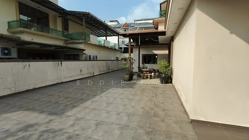 Exterior features: paved walkway, outdoor seating area with table and chairs, plant pots with greenery, surrounding buildings, open sky, flat roof structure, concrete wall; style: modern.