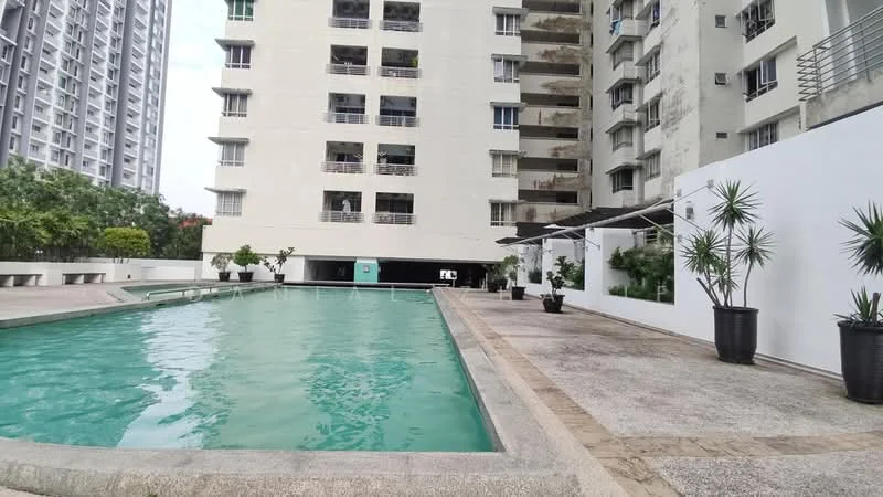 Exterior type: mid-rise condominium; features: swimming pool, pool deck with loungers, landscaped garden, manicured lawn, potted plants, balconies on upper floors, concrete facade, glass railing, covered outdoor seating area; style: modern.