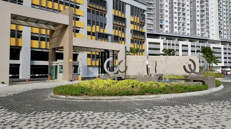Exterior type: high-rise condominium; features: modern entrance with canopy, landscaped garden with decorative stones, water feature with fountain, paved circular driveway, surrounding palm trees, multi-storey parking structure, yellow and grey facade, security guardhouse at entrance; style: modern.