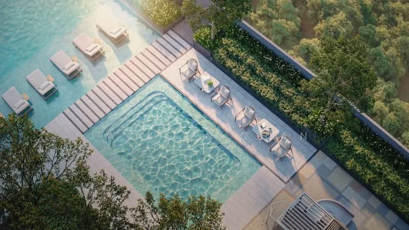 Exterior type: swimming pool deck; features: infinity pool, lap pool, pool deck with loungers, outdoor dining area with chairs and table, landscaped greenery surrounding the pool, stone-paved walkway, sun loungers, poolside seating area; style: modern.