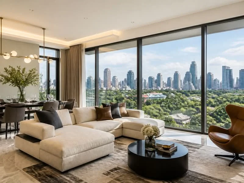 Living features: L-shape sectional sofa in cream fabric, round coffee table with black surface, area rug with geometric pattern, floor-to-ceiling windows, city skyline view, recessed downlights, decorative vase with flowers, decorative wall art, wooden accent chair, dining area visible in background with dining table and chairs; style: modern; view: city.
