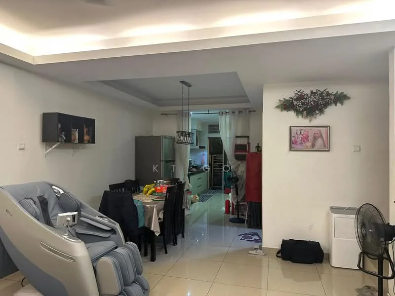 Living features: white painted walls, glossy tile flooring, recessed ceiling with LED lighting, dining table with black chairs, grey fabric recliner chair, decorative wall art, floor fan, kitchen area visible in background, green and red decorative items, curtains, open layout to kitchen; style: modern.