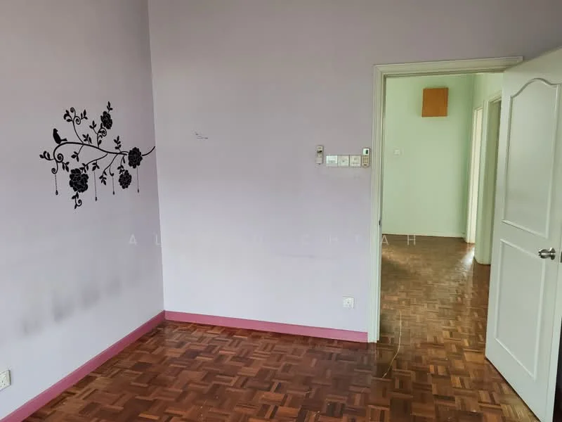 Room features: purple painted walls, wooden parquet flooring, white door, decorative wall decal with floral design, light switch, door frame, visible door to another room.