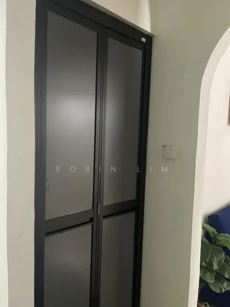 Room features: black framed sliding door, frosted glass panels, white painted walls, light-colored flooring; style: modern.