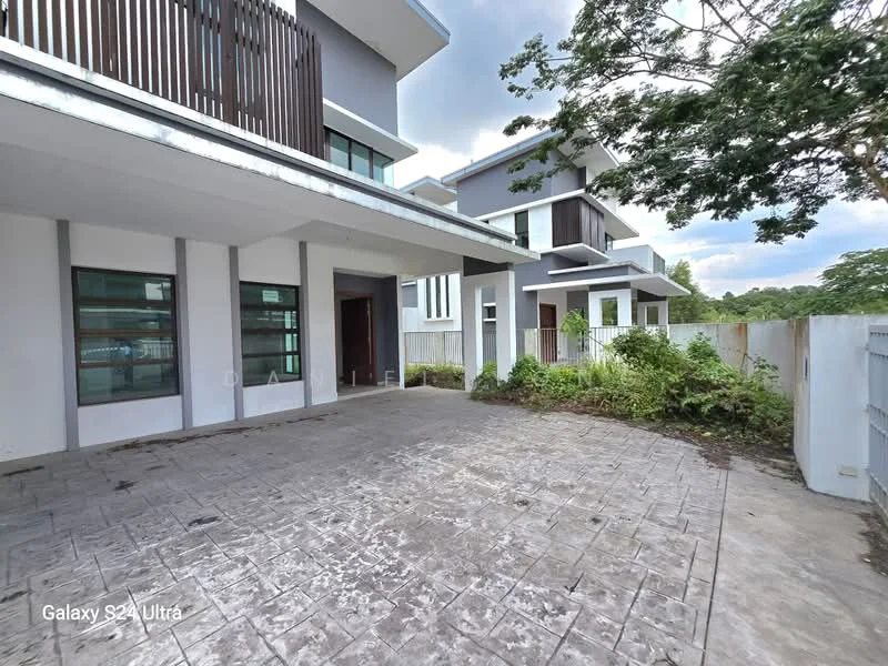 Exterior type: semi-detached house; features: grey painted facade, flat roof, two-storey structure, manicured landscaping, paved driveway, large windows, wooden balcony railing, surrounding greenery, fenced perimeter; style: modern.