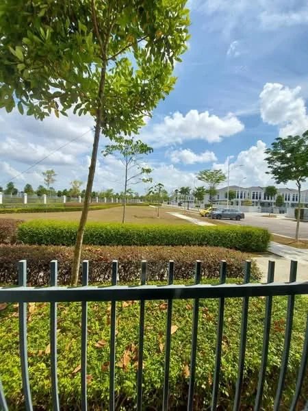Exterior features: manicured lawn, mature trees, landscaped garden, fenced perimeter, paved walkway, residential street view, clear blue sky, scattered clouds; style: modern.