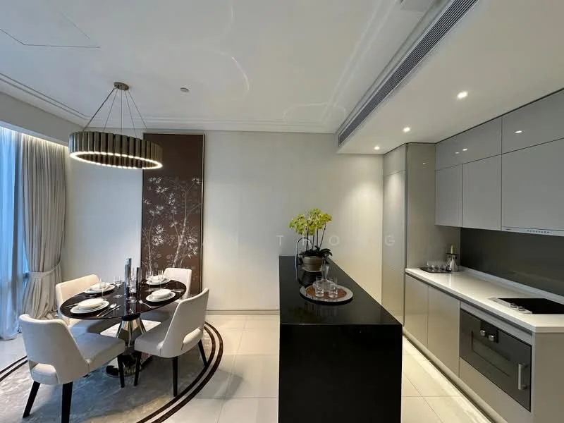 Kitchen features: black countertop, grey cabinetry, built-in oven, stainless-steel sink, chrome pull-down faucet, recessed downlights, ceramic tile flooring, wall-mounted kitchen appliances, open shelving, decorative wall art, floor-to-ceiling windows with sheer curtains; style: modern. Dining features: round dining table, upholstered dining chairs, table setting with plates and cutlery, chandelier with circular design; style: modern.