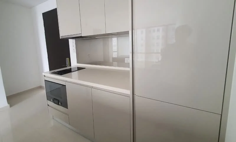 Kitchen features: glossy grey cabinetry, white quartz countertop, built-in oven, induction cooktop, integrated refrigerator, single-bowl stainless-steel sink, chrome pull-down faucet, backlit mirror, tile backsplash, recessed downlights, neutral wall color, cream tile flooring; style: modern.