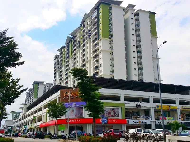 Exterior type: high-rise condominium; features: glass curtain wall, green accent panels, multiple balconies, commercial units on ground floor, signage for various businesses, manicured landscaping, surrounding trees, parking spaces visible, urban setting, modern architectural design; style: modern.