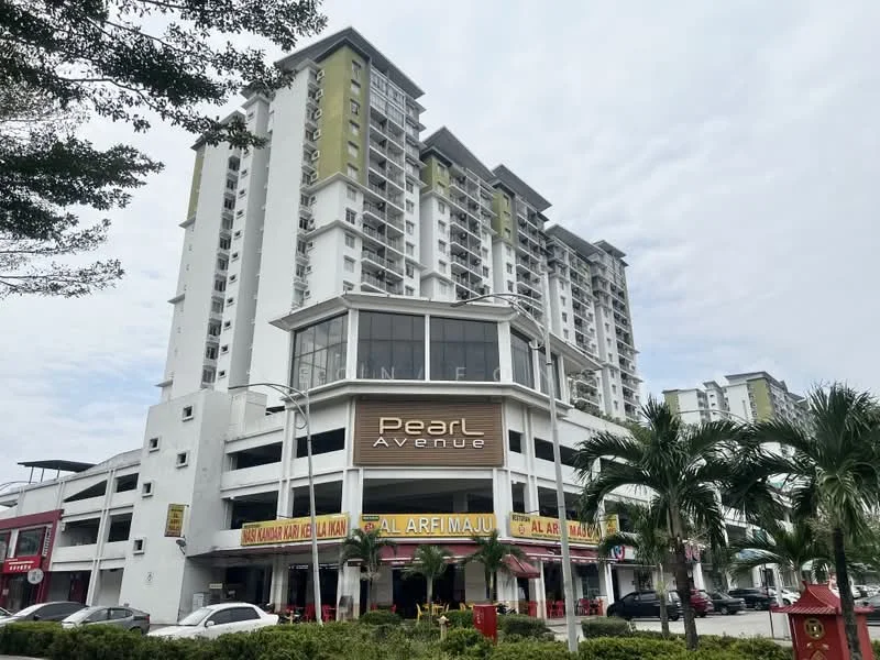 Exterior type: mid-rise condominium; features: white painted facade, glass curtain wall, projecting balconies, multiple storeys, commercial units at ground level, signage for 'Pearl Avenue', surrounded by palm trees, manicured landscaping; style: modern.