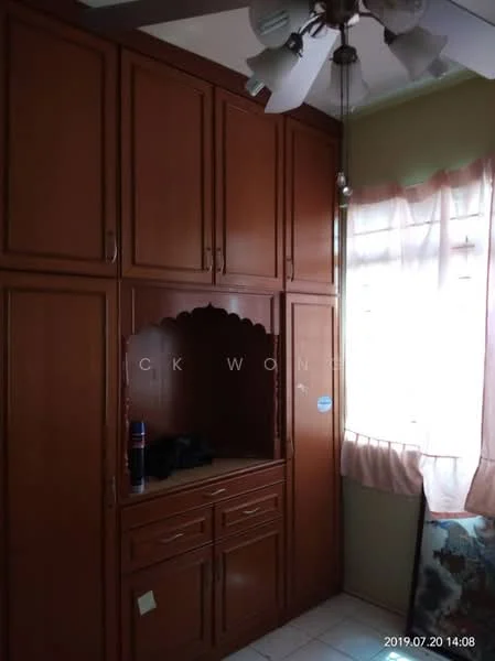 Room features: built-in wooden cabinetry in brown, open shelving with decorative arch, ceiling fan with 5 blades, white walls, window with sheer curtains, tile flooring, corner space for additional storage, decorative wall art; style: traditional.