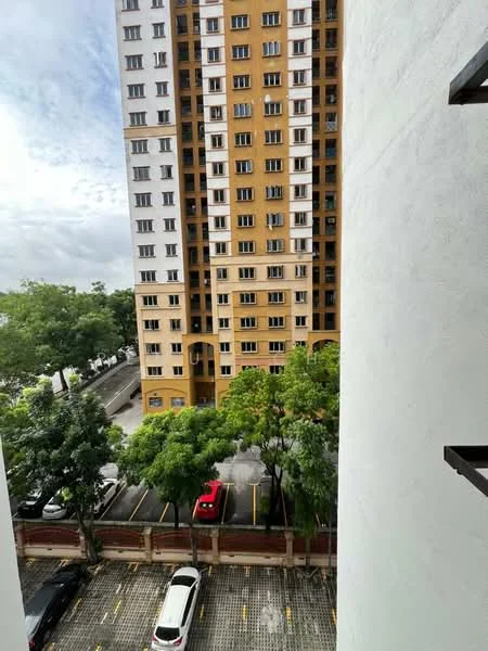 Exterior type: high-rise condominium; features: yellow and white painted facade, multiple windows, surrounded by trees, parking lot visible, cars parked in designated spaces, urban setting, nearby greenery; style: modern.