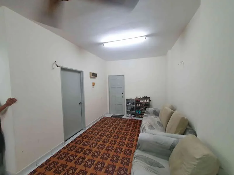 Living features: light-coloured painted walls, vinyl flooring with geometric pattern, 3-seater fabric sofa in light colour, ceiling-mounted fluorescent lighting, single door with grey finish, shoe rack, air conditioning unit, window with no visible treatment; style: minimalist.
