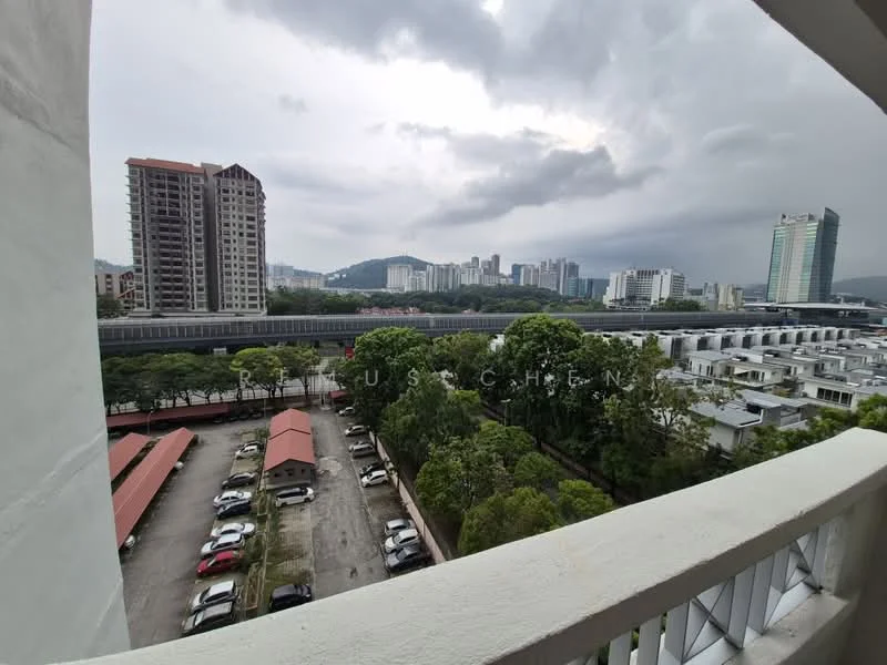 Exterior type: high-rise condominium; features: city skyline view, surrounded by greenery, parking lot with multiple cars, residential buildings in the background, train tracks visible, cloudy sky, nearby low-rise houses, urban landscape; style: modern.