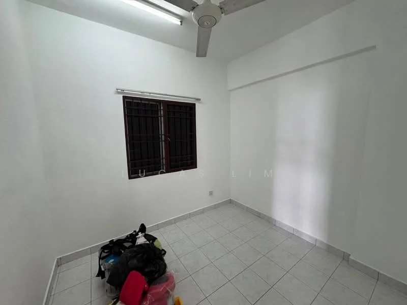 Room features: white painted walls, tile flooring, ceiling fan, window with metal grille, natural light from window, empty space, no visible furniture, light fixture on ceiling.