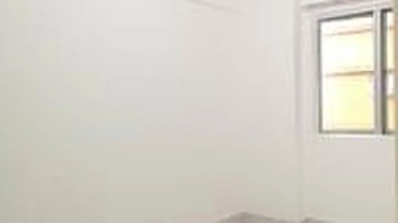 Room features: white painted walls, grey tile flooring, single window.