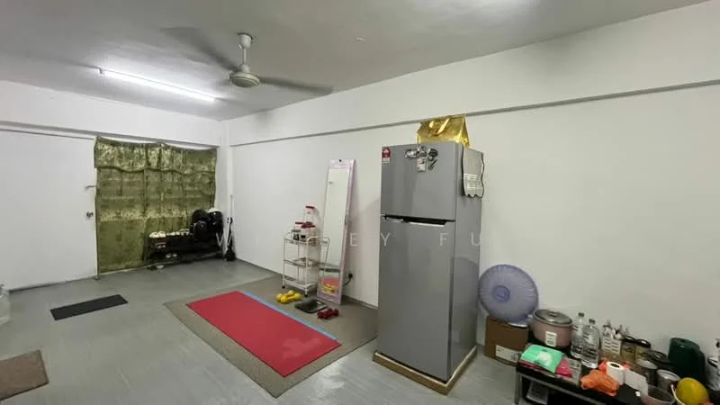 Room features: grey painted walls, vinyl plank flooring, ceiling fan, refrigerator, full-length mirror, exercise mat, shoe rack, plastic storage containers, decorative wall hanging, small fan, various household items on the floor; style: minimalist.