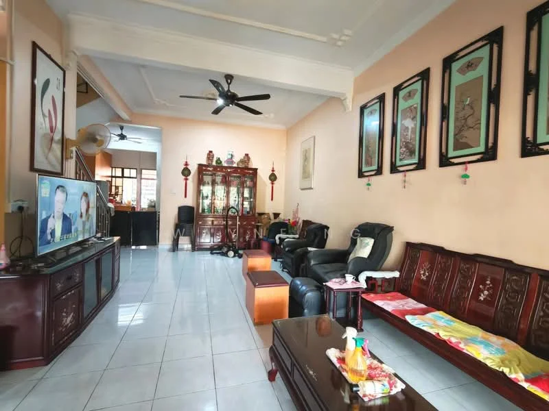 Living features: cream painted walls, white ceiling with crown moulding, polished tile flooring, 5-blade ceiling fan, wall-mounted TV, dark wood TV console, dark wood coffee table, black leather recliners, wooden sofa set with intricate carvings, decorative wall art, area rug, window with sheer curtains; style: traditional.