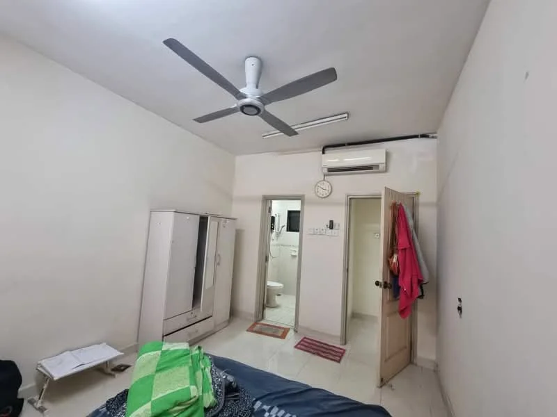 Bedroom features: white painted walls, polished tile flooring, 5-blade ceiling fan with light, wall-mounted split AC, built-in wardrobe with sliding doors, doorway leading to bathroom, doorway leading to hallway, clock on wall, area rug, bed with bedding.