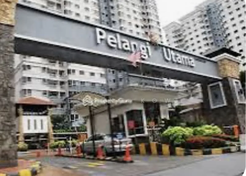 Exterior type: high-rise condominium; features: main entrance gate, guard house at entrance, surrounded by mature greenery, paved driveway, landscaped garden, multiple-storey building, residential complex, visible parking area; style: modern.