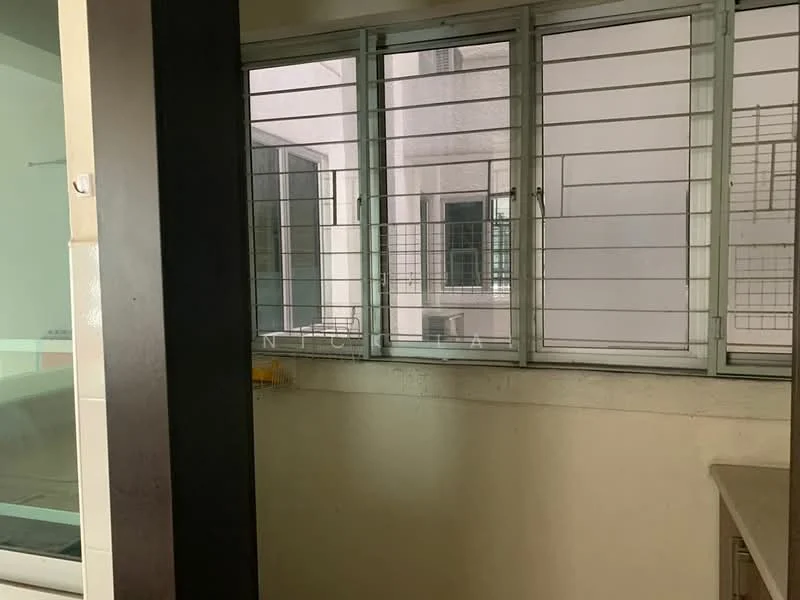 Room features: window with metal grilles, white walls, countertop, unknown cabinetry, unknown flooring.