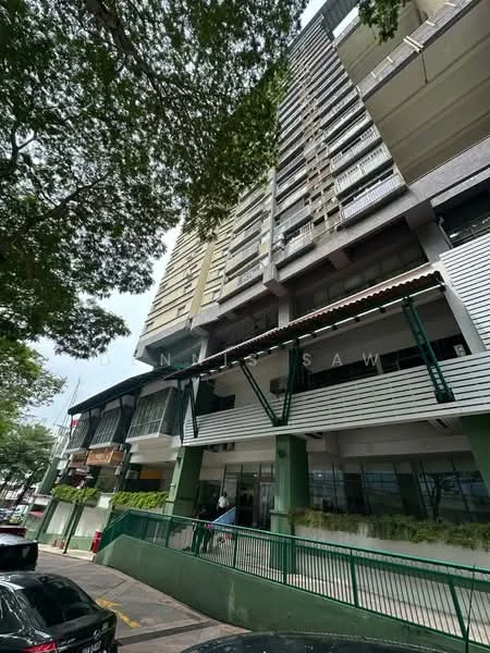 Exterior type: high-rise condominium; features: glass curtain wall, white painted facade, green accents, multiple balconies, commercial units at ground level, parking area visible, surrounded by trees, modern architectural design; style: modern.