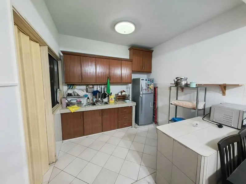 Kitchen features: white tiled flooring, wood cabinetry in brown, granite countertop, stainless-steel fridge, built-in microwave, kitchen sink, kitchen shelf, window above sink, ceiling light fixture; style: modern.