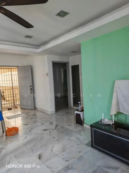 Room features: marble flooring, white painted walls, green accent wall, ceiling with recessed lighting, 5-blade ceiling fan, wooden door, large window with metal grille, black TV console, decorative items on console, orange plastic bag; style: modern.