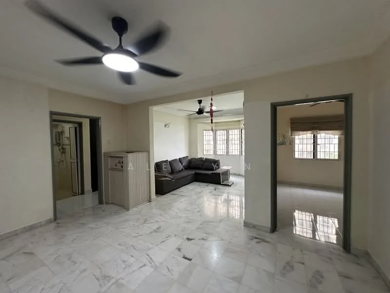 Living features: marble tile flooring, white painted walls, 5-blade ceiling fan with light, sofa in dark grey, large windows with blinds, decorative wall hanging, open layout to adjacent rooms; style: modern. Kitchen features: marble tile flooring, white painted walls, wall-mounted cabinets, sink, kitchen appliances visible; style: modern.