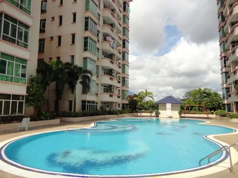 Exterior type: mid-rise condominium; features: swimming pool with curved edges, pool deck with loungers, landscaped garden area, surrounding palm trees, covered gazebo, playground area, multiple floors visible, balconies on upper floors; style: modern.