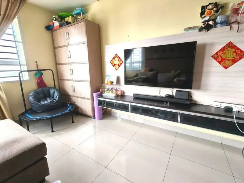 Living features: light yellow painted walls, glossy ceramic tile flooring, large wall-mounted TV, black TV console with storage, wooden storage cabinet, blue fabric chair, decorative wall art, curtains, window with horizontal slats, decorative items on shelves; style: modern.