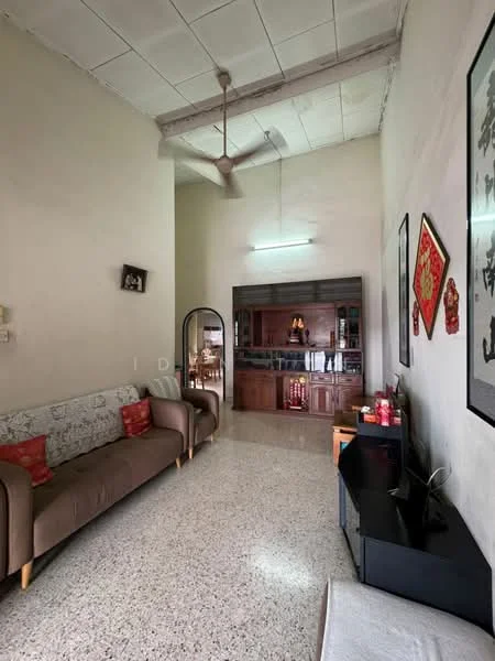 Living features: sofa with light fabric upholstery, wooden legs on sofa, decorative cushions in red, polished concrete flooring, exposed beams on ceiling, recessed ceiling lights, wall-mounted TV, black TV console, framed artwork on walls, wall-mounted decorative items, open layout to kitchen area, wood cabinetry in kitchen area, kitchen counter visible in background; style: modern.