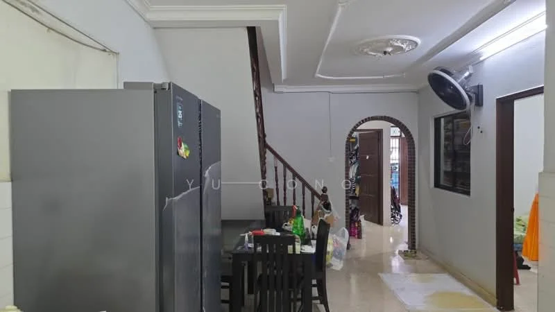 Room features: grey stainless-steel fridge, black dining table with four chairs, cream painted walls, polished floor tiles, staircase with wooden railing, wall-mounted ceiling fan, recessed ceiling lights, doorway leading to another room; style: modern.