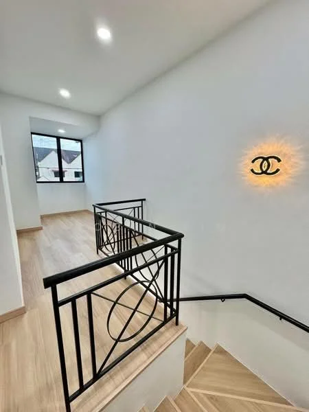 Room features: wooden staircase, black metal railing, white painted walls, recessed ceiling lights, large window with view, laminate flooring, decorative wall light; style: modern.