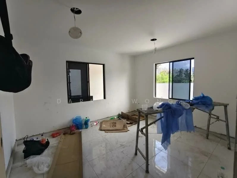 Room features: white painted walls, marble tile flooring, two windows, ceiling light fixtures, unfinished space with construction materials, plastic sheets, cardboard boxes, scattered debris.