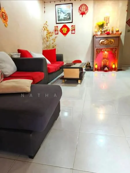 Living features: grey fabric L-shape sectional sofa, red accent cushions, coffee table with wooden top, white tiled flooring, decorative wall art, red wall decorations, small altar with candles, ambient lighting, potted plant, wall-mounted picture frame; style: modern.