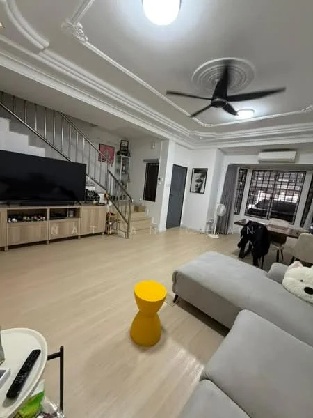 Living features: 5-blade ceiling fan with light, recessed downlights, wall-mounted TV, TV console with storage, light wood flooring, cream painted walls, sofa in light grey fabric, yellow accent side table, large windows with black grilles, staircase with metal railing, air conditioning unit, decorative wall art; style: modern.