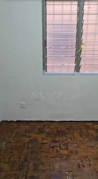 Room features: white painted walls, wooden flooring, window with metal grille.