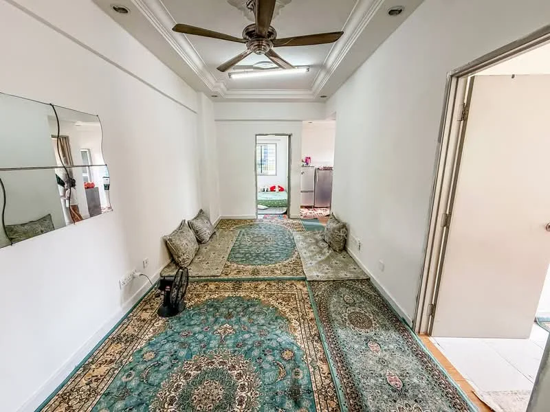 Room features: white painted walls, tray ceiling, 5-blade ceiling fan, area rug with intricate pattern, two seating areas with cushions, doorway leading to another room, tile flooring, mirror on wall; style: modern.