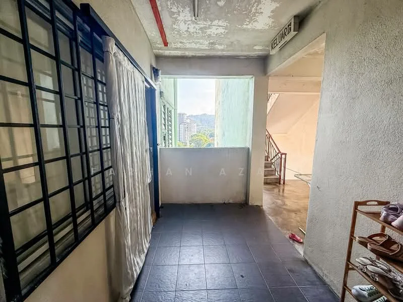 Room features: grey tiled flooring, white painted walls, black-framed windows, curtains, staircase visible, green wall, city view visible through window, open space layout; view: city.