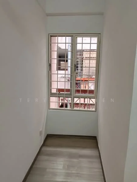Room features: white painted walls, laminate flooring, window with metal grille, natural light from window.