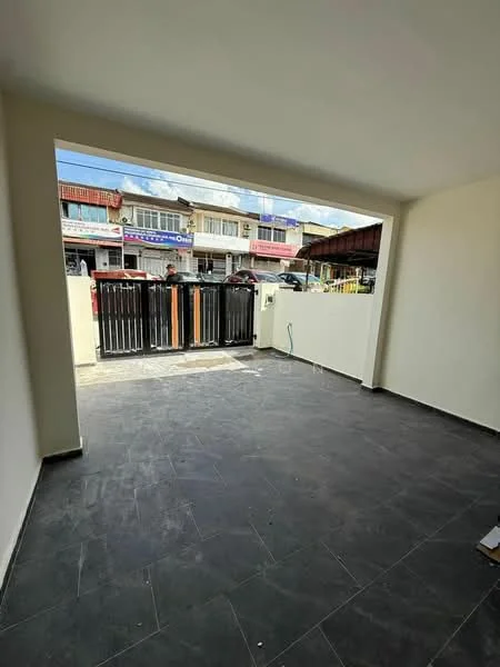 Room features: grey tiled flooring, plain white walls, large opening to exterior, view of gated entrance, natural light from window, no visible furniture or decor; style: modern; view: street.