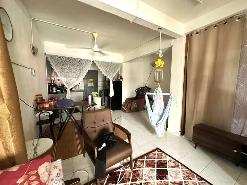Living features: white painted walls, ceramic tile flooring, 5-blade ceiling fan, sofa in dark brown, wooden coffee table, dining table with chairs, hanging baby hammock, curtains in beige, decorative area rug with geometric pattern, wall-mounted clock; style: modern. Kitchen features: black appliances, refrigerator, kitchen cabinets, countertop, open layout to living area; style: modern.